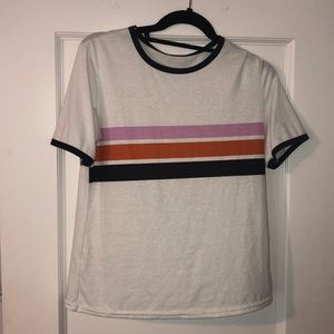 White tee with pink, orange, and black stripes